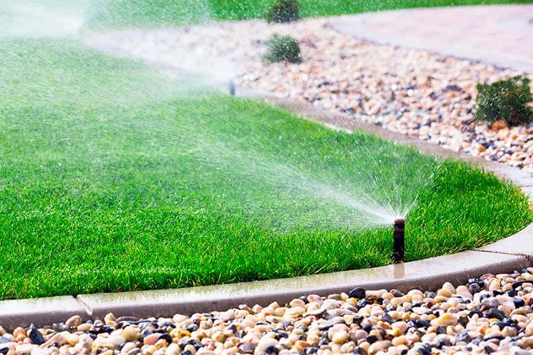 Automatic Sprinklers Watering Grass